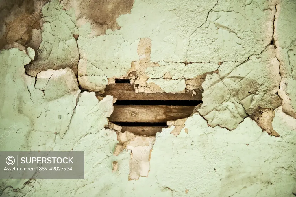 Wallpaper peels away from walls in an abandoned house; Dunbar, Nebraska, United States of America