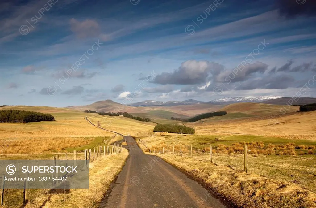 scottish borders, scotland, a road with fields on both sides