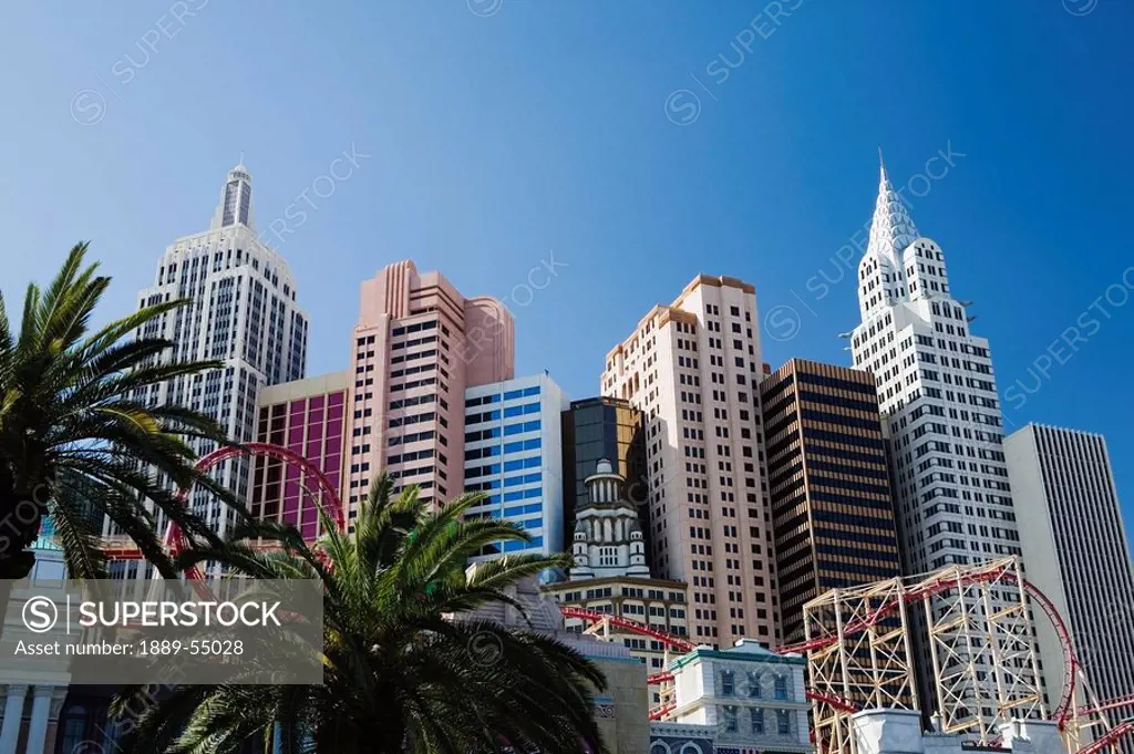 Las Vegas, Nevada, United States Of America, Building Facades Of New York, New York With Roller Coaster And Palm Trees