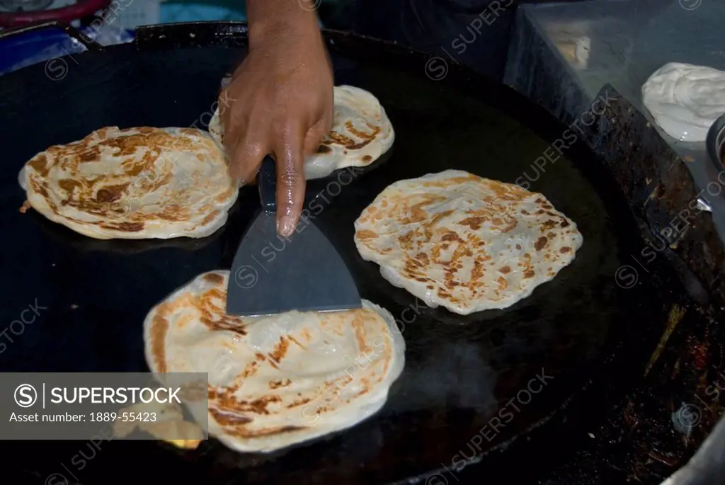 Kuala Lumpur, Malaysia, A Person Making Pancakes