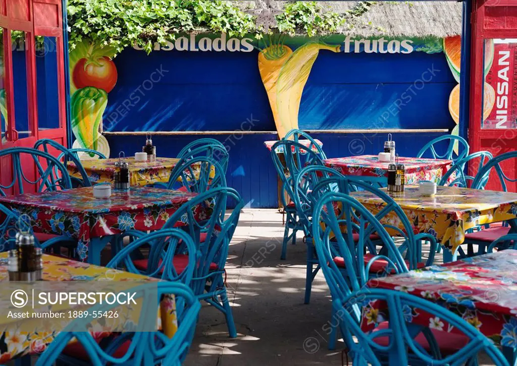 tarifa, cadiz, andalusia, spain, tables and chairs at a restaurant at punta paloma beach