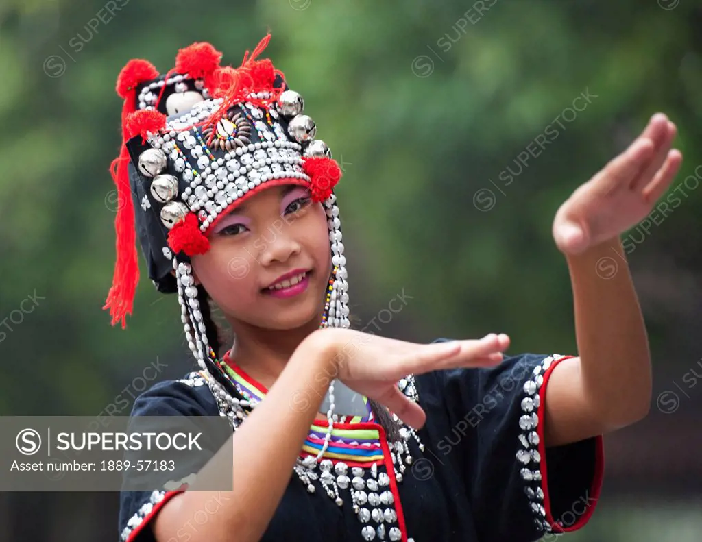A Thai Girl Dresses In An Akha Hill Tribe Costume, Chiang Mai, Thailand