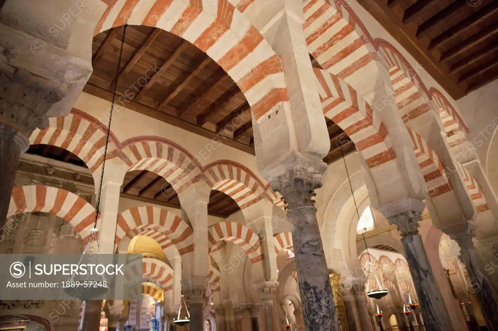 Striped Arches, Columns And A Wooden Ceiling In The Cathedral Of Our Lady Of The Assumption Great Mosque Of Cordoba, Cordoba, Andalusia, Spain