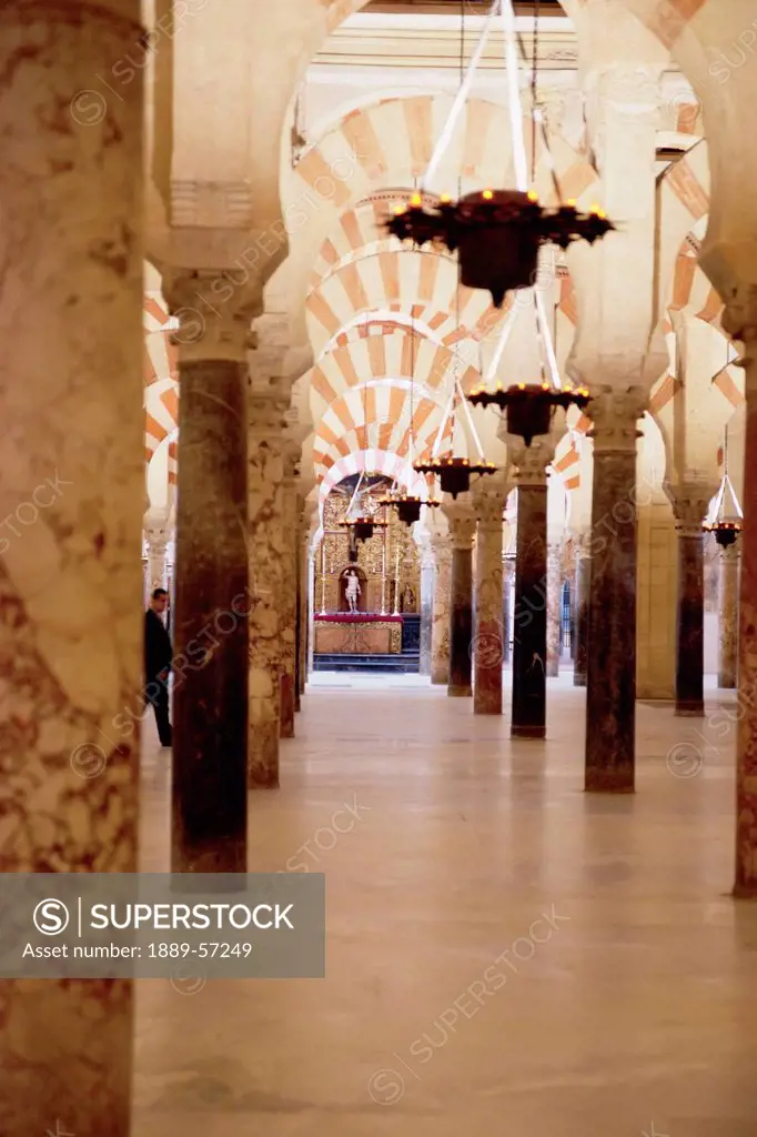 An Aisle Of Striped Arches And Columns In The Cathedral Of Our Lady Of The Assumption Great Mosque Of Cordoba, Cordoba, Andalusia, Spain