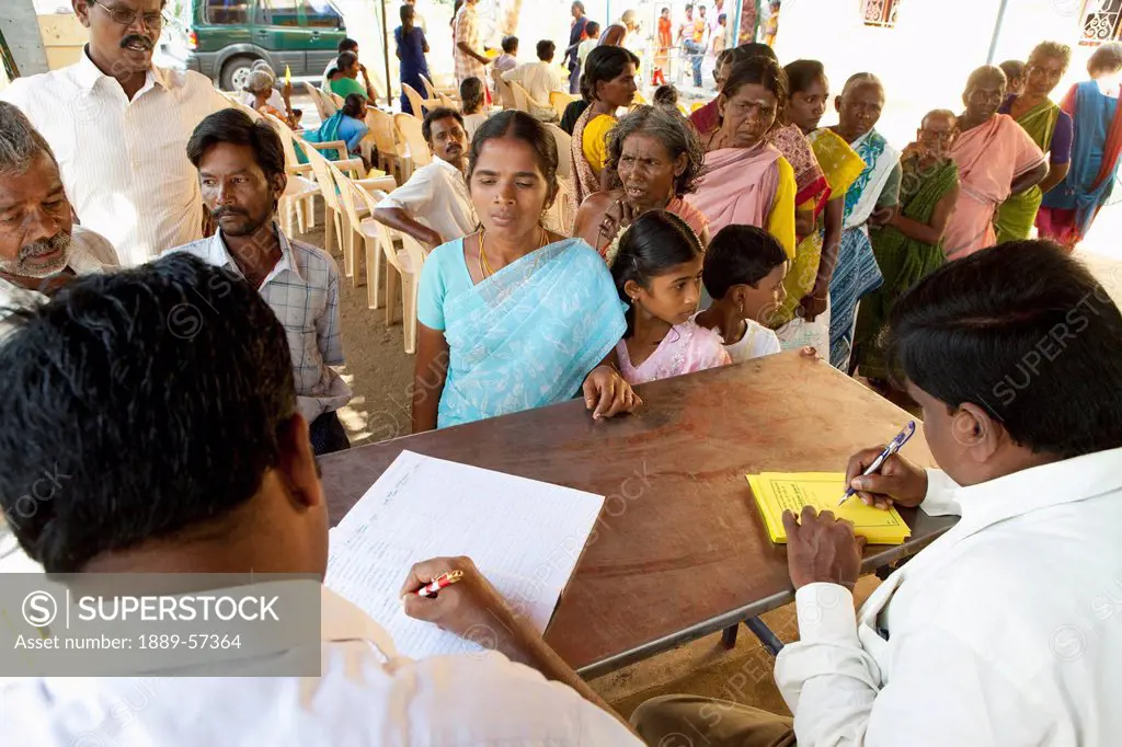 People Lined Up At A Registration Table, Sathyamangalam, Tamil Nadu, India