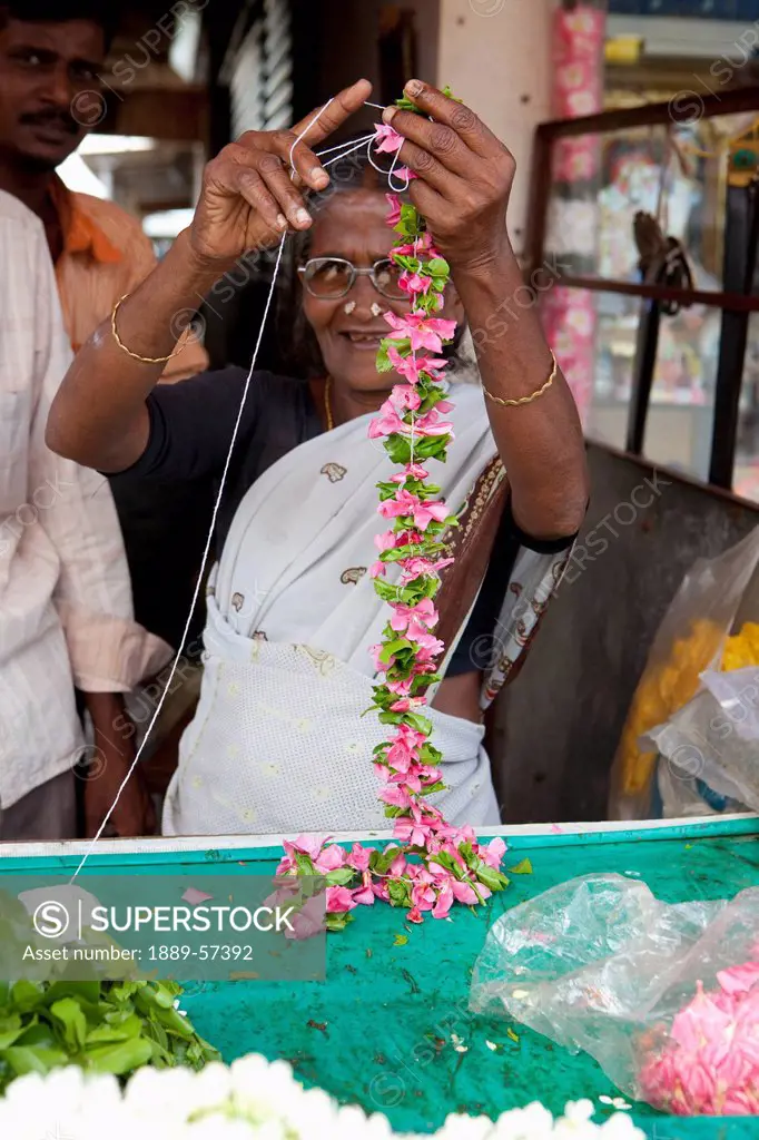 A Woman Making A Flower Lei, Sathyamangalam, Tamil Nadu, India