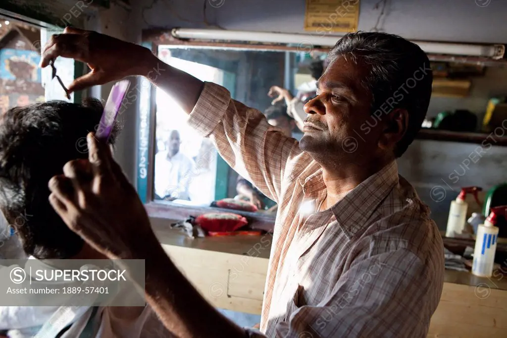 A Barber Cutting A Man´s Hair, Sathyamangalam, Tamil Nadu, India