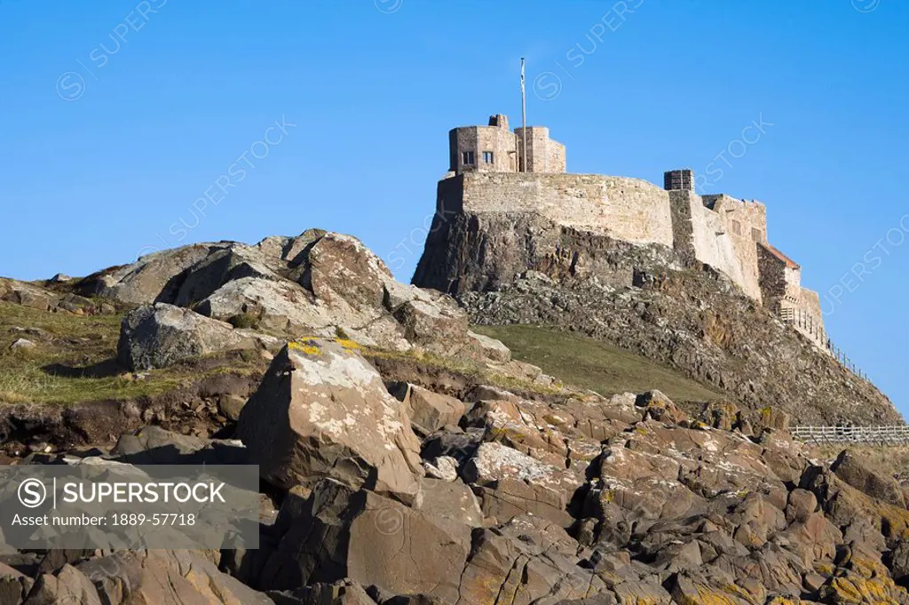 Castle on cliff, Northumberland, England