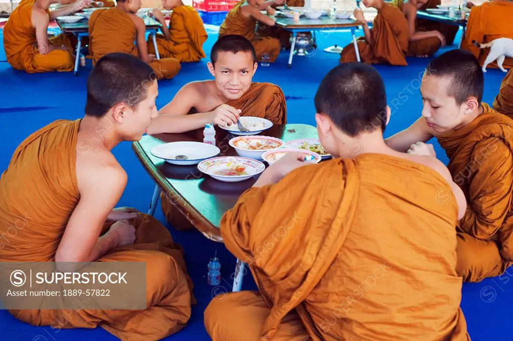 Buddhist monks eating in Thailand