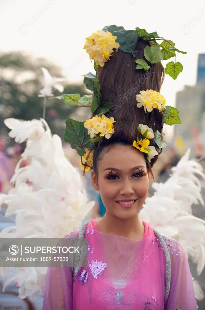 Woman with elaborate hairstyle in Flower Festival, Chiang Mai, Thailand