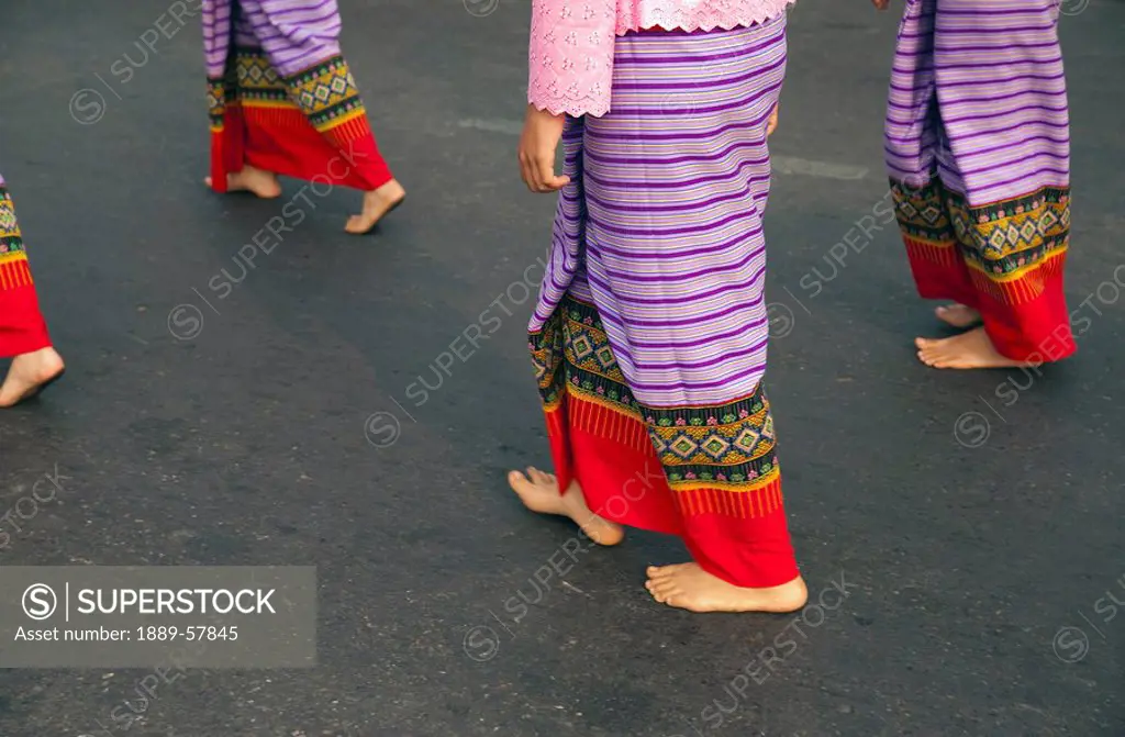 Walking barefoot in costume, Flower Festival, Chiang Mai, Thailand