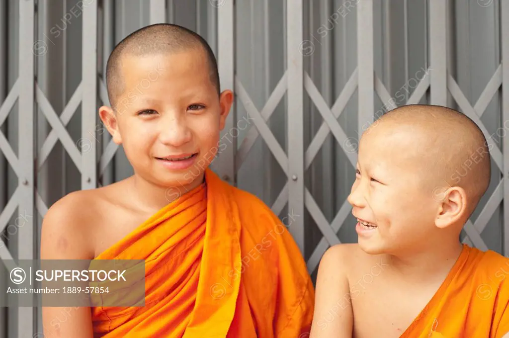Two young boys wearing sarongs