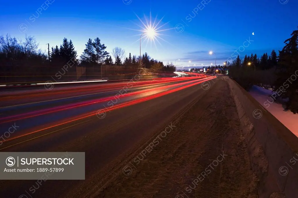 Red tail lights at twilight, St. Albert, Alberta, Canada