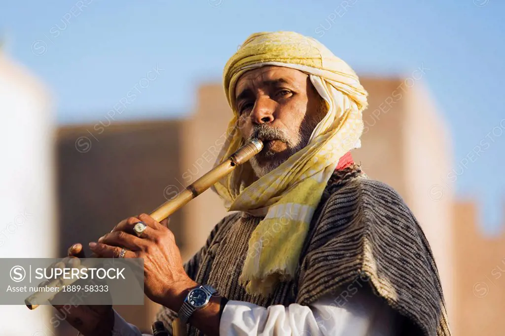 Portrait of man playing flute in Essaouira, Morocco