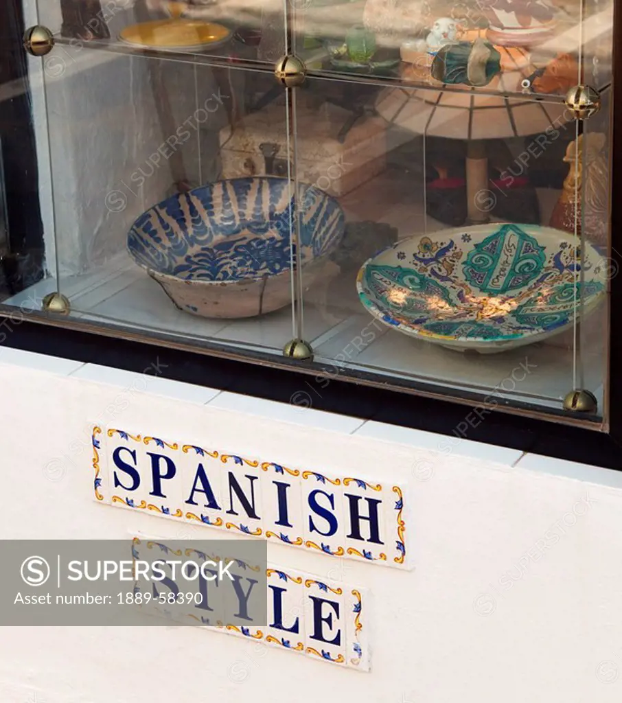 Spanish antique pottery in store window, Marbella, Malaga, Spain