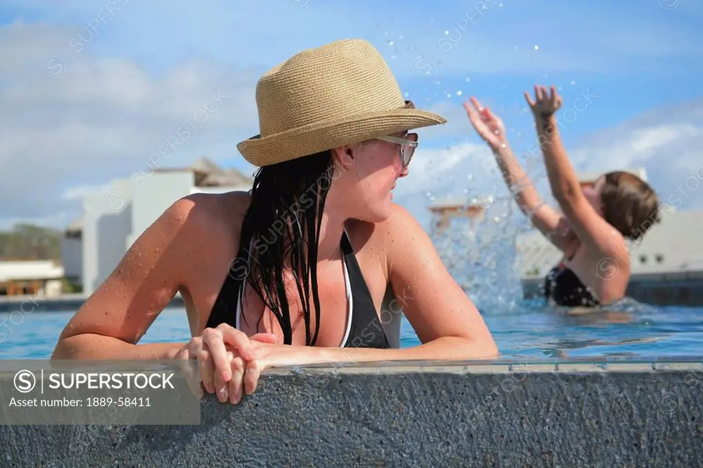 Women relaxing in pool, Cabo San Lucas, Mexico