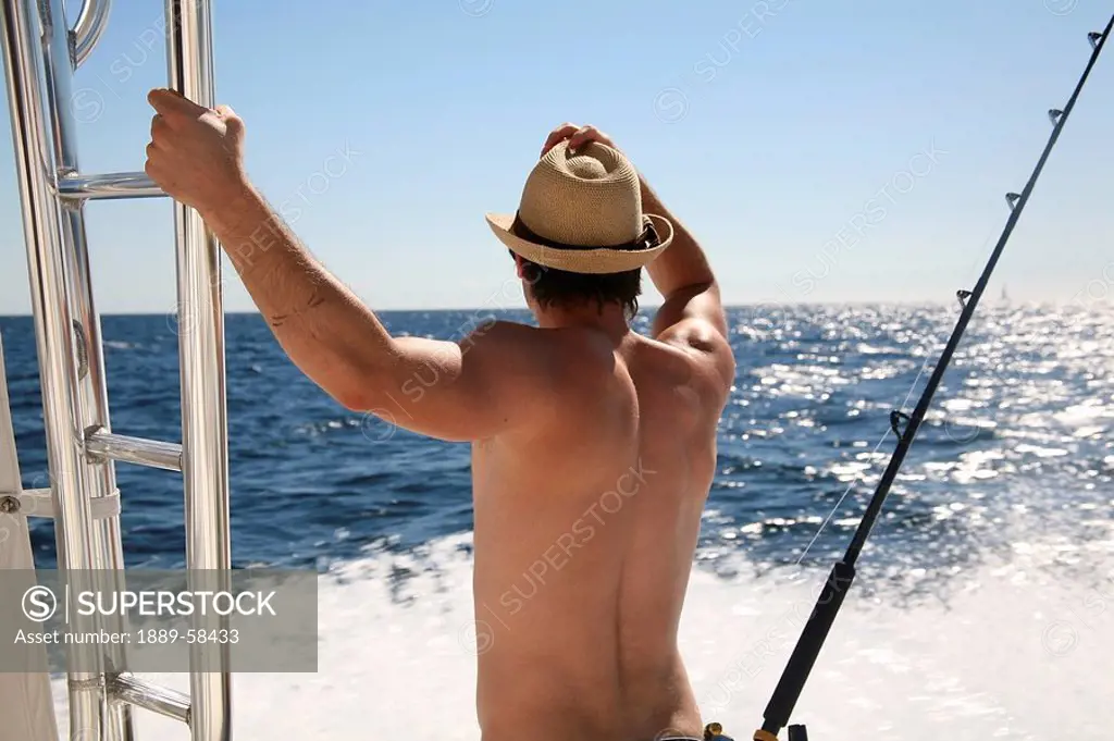 Man on boat, Cabo San Lucas, Mexico