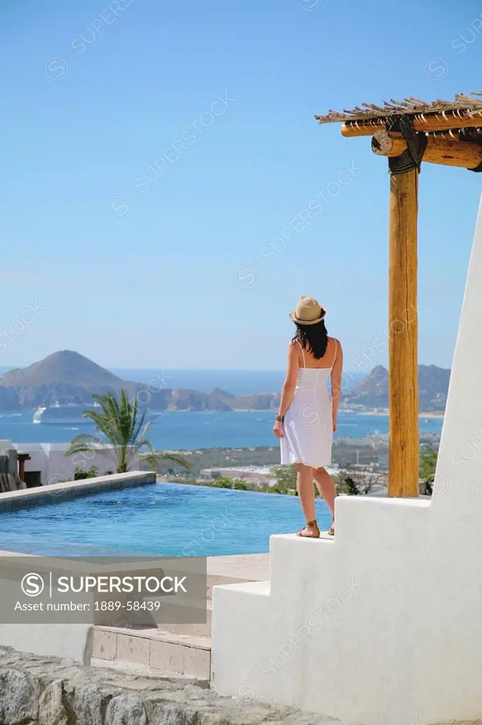 Woman on terrace of resort, Cabo San Lucas, Mexico