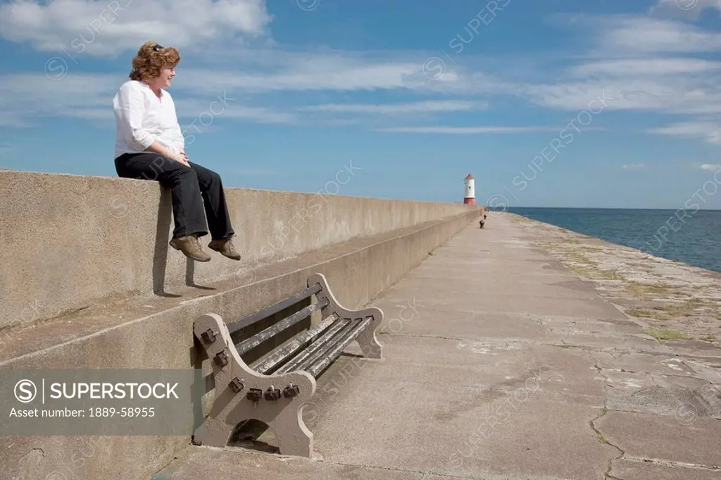 Woman looking out at the water
