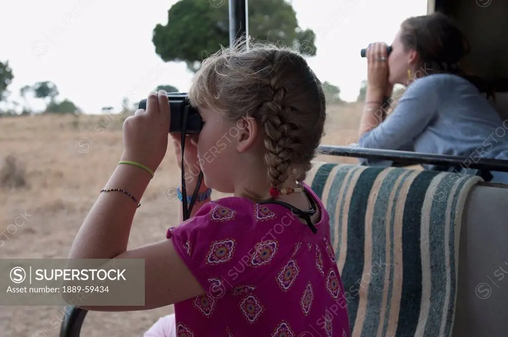 Children with binoculars, Kenya, Africa