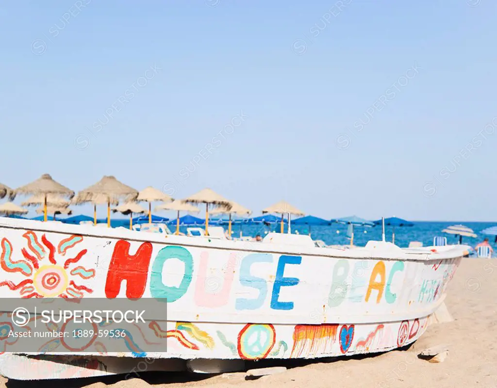 Decorated fishing boat on La Carihuela beach, Torremolinos, Costa del Sol, Malaga, Spain