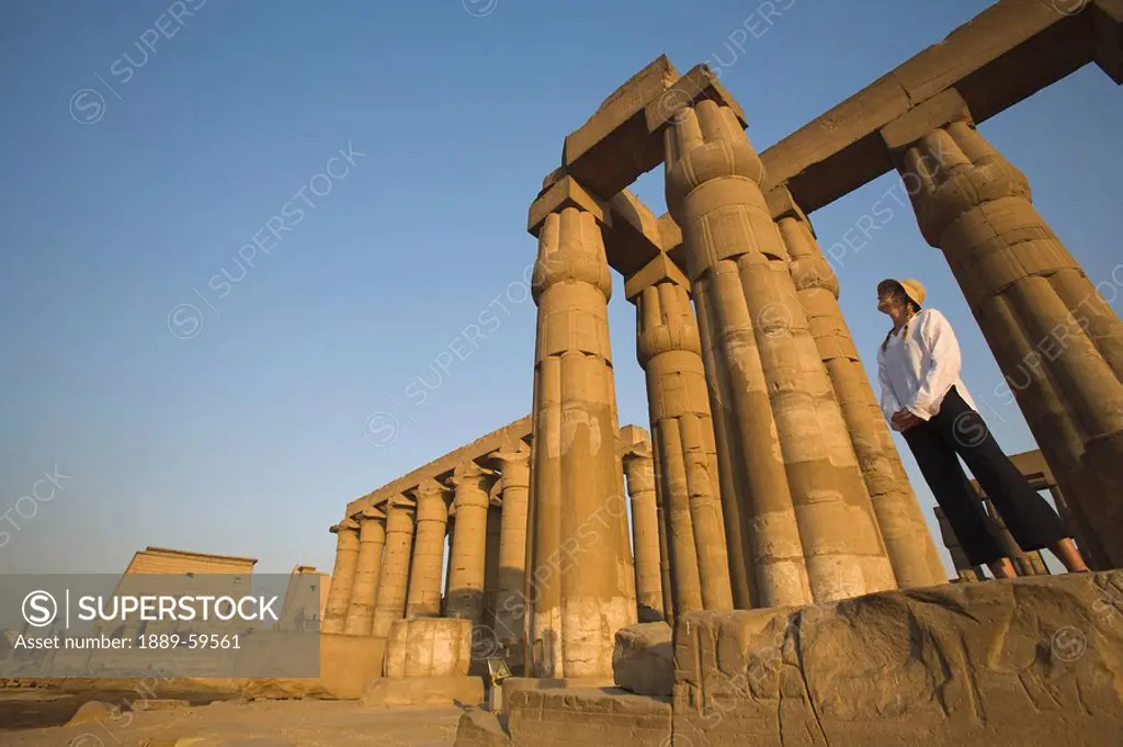 Woman tourist at the Temple of Luxor, Luxor, Nile Valley, Egypt