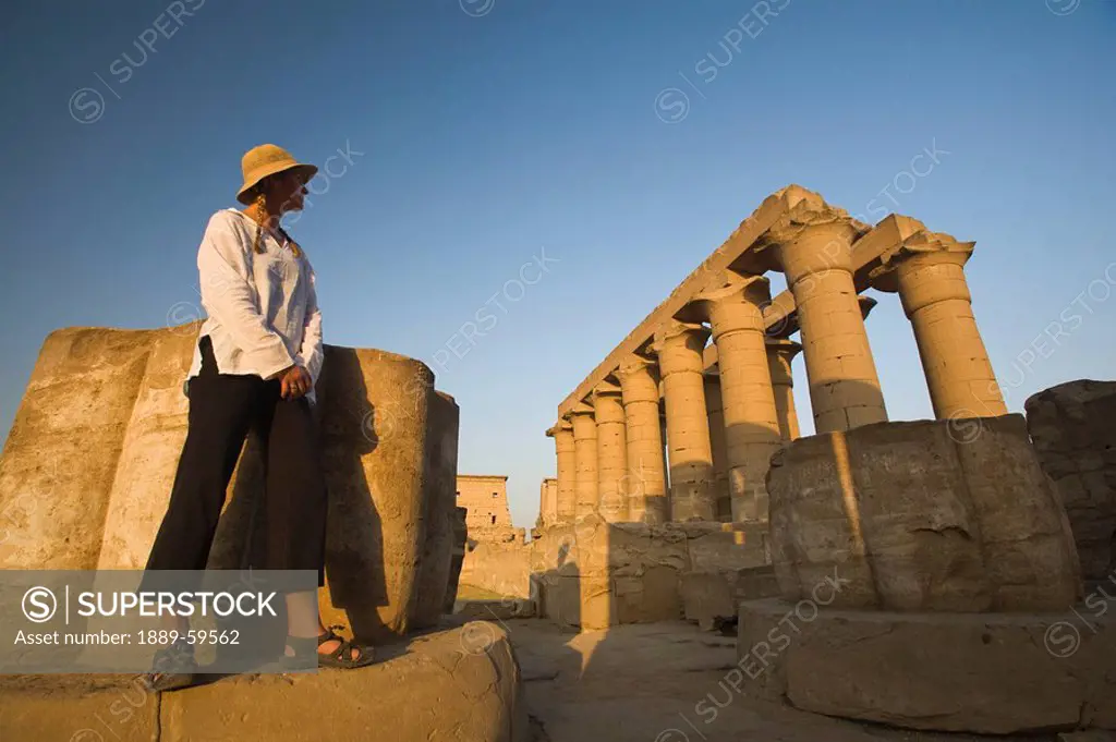 Woman tourist at the Temple of Luxor, Egypt