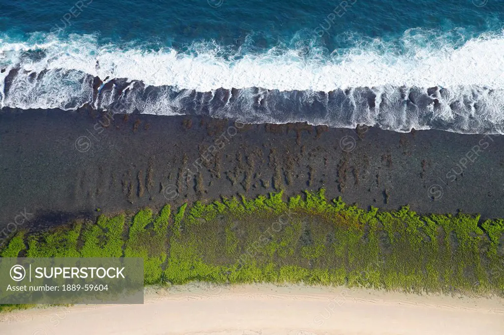 Aerial view over the reefs and beaches of the Bukit Peninsula of Bali, Indonesia