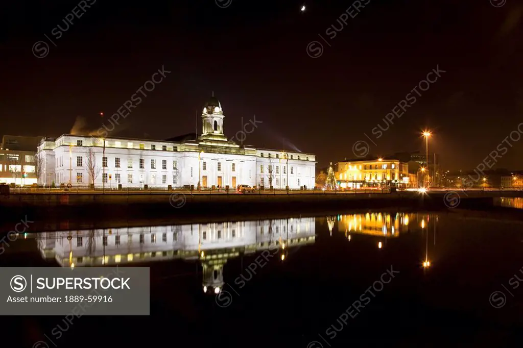 Cork, Cork County, Ireland, City Hall Illuminated At Night Along River Lee