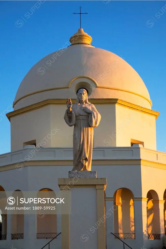 Chiclana De La Frontera, Andalusia, Spain, A Statue Of Jesus In Front Of A Church Building
