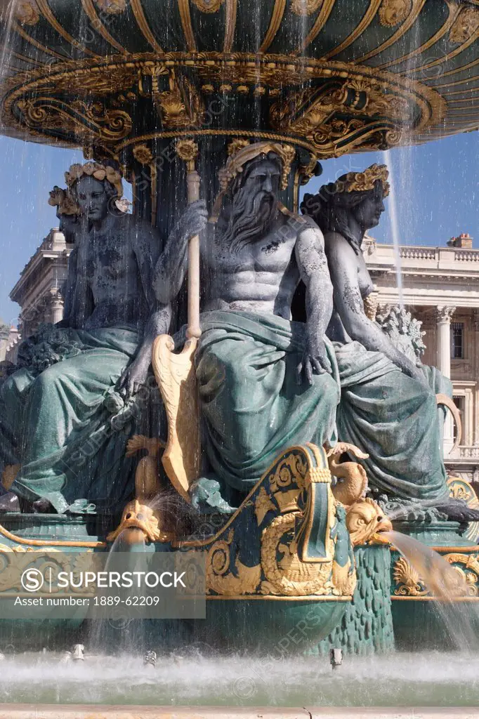 statues in a fountain, paris, france