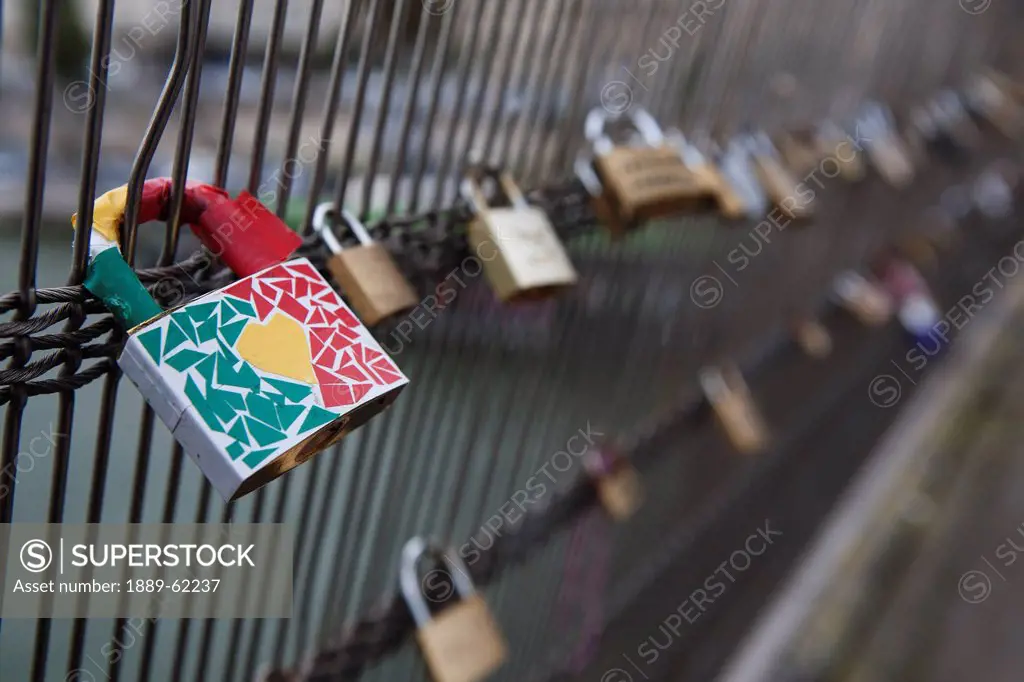 love locks attached to ponts des arts bridge fencing, paris, france