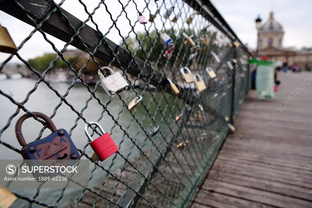 love locks attached to ponts des arts bridge fencing, paris, france