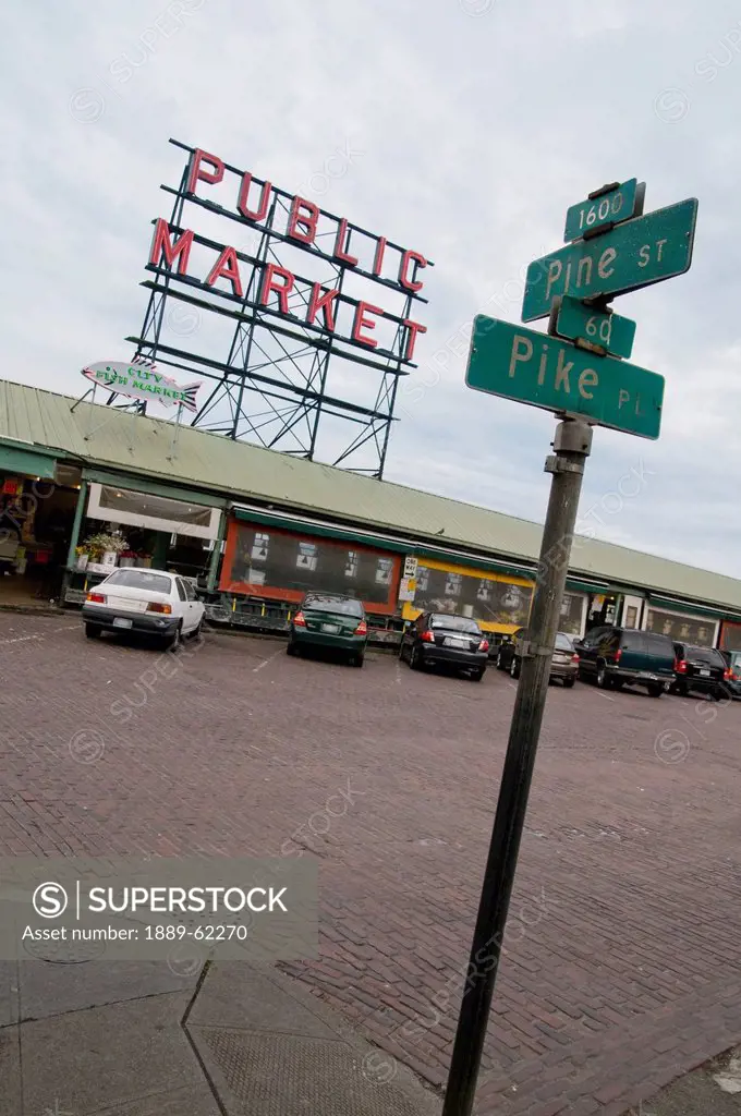 street signs and cars parked at a public market, seattle, washington, united states of america