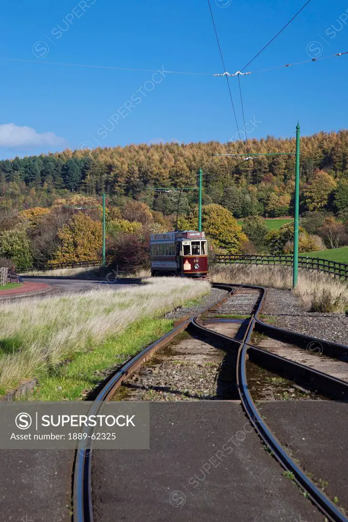 a rail car travels down the tracks, beamish, durham, england