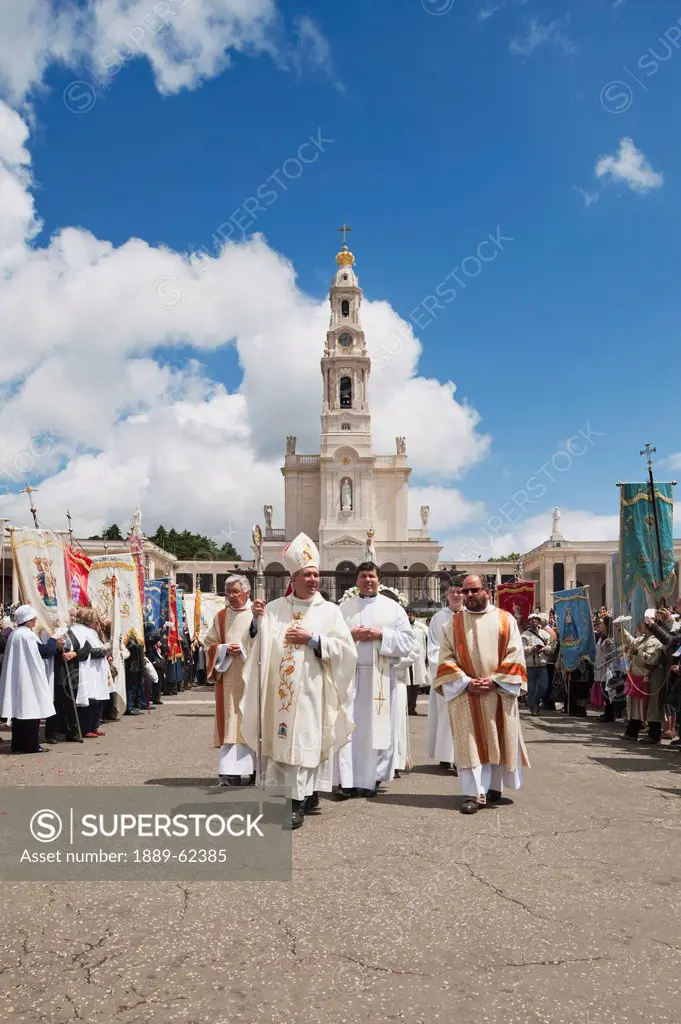 religious leaders walk through the crowd at the basilica of fatima, fatima, estremadura and ribatejo, portugal