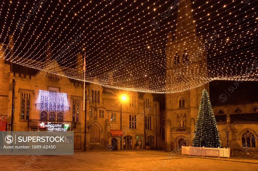 twinkling lights by church at christmas, durham, england