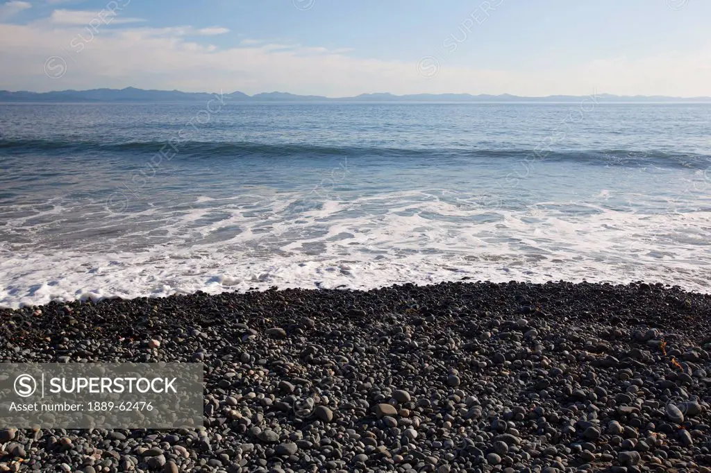 view of the olympic mountains from the juan de fuca marine trail, mystic beach, vancouver island, british columbia, canada