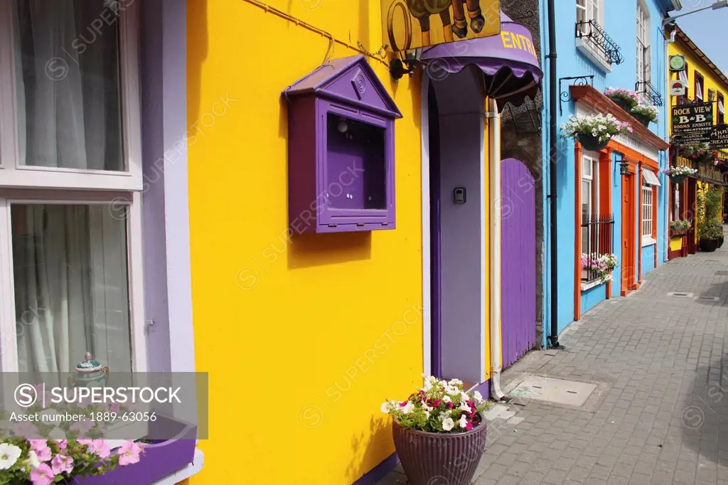 painted buildings on main street in munster region, kinsale, county cork, ireland