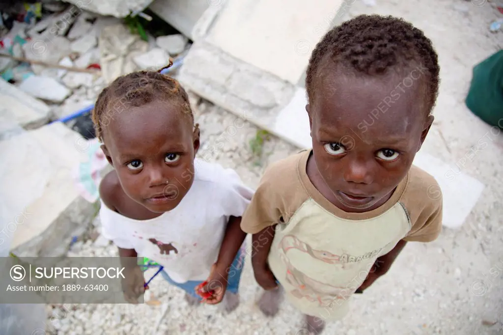 two children standing in earthquake ruins, port_au_prince, haiti