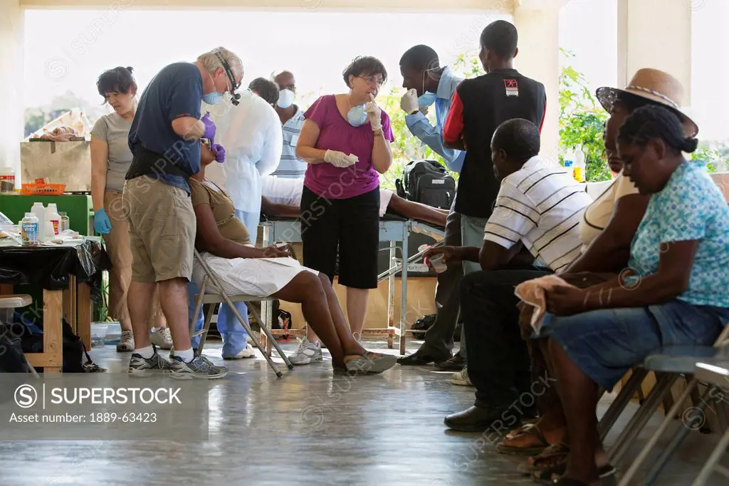 a dentist volunteers his dentistry to help haitian people who are living in poverty, grand saline, haiti