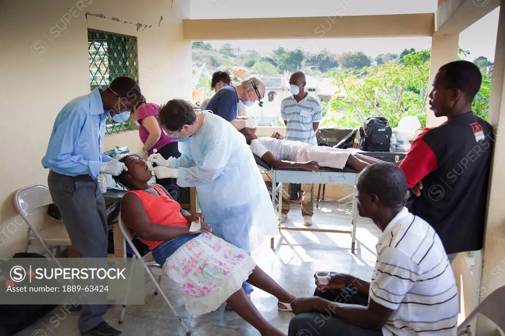 dentists volunteer their dentistry to help haitian people who are living in poverty, grand saline, haiti