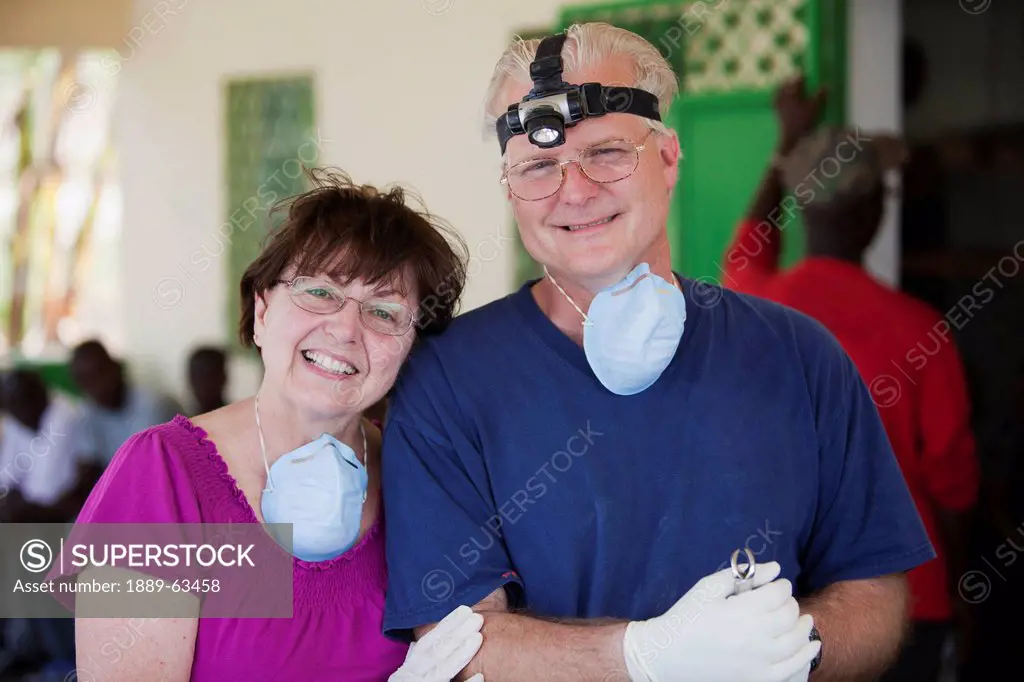 a dentist and his mother volunteer on a medical team helping the haitians living in poverty, grand saline, haiti