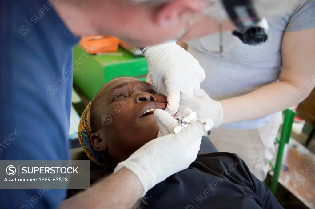 a dentist volunteers his dentistry to help haitians in poverty, grand saline, haiti