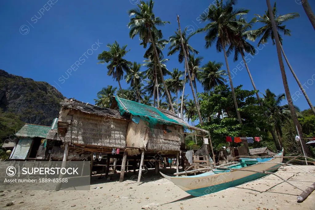 palm_leaf stilt houses on the beach, corong corong, bacuit archipelago, palawan, philippines