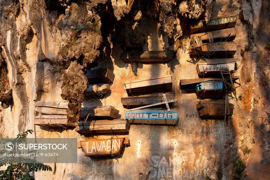 the famous hanging coffins rest high on the limestone cliffs in echo valley near the mountain village of sagada, in the cordillera region, north luzon...