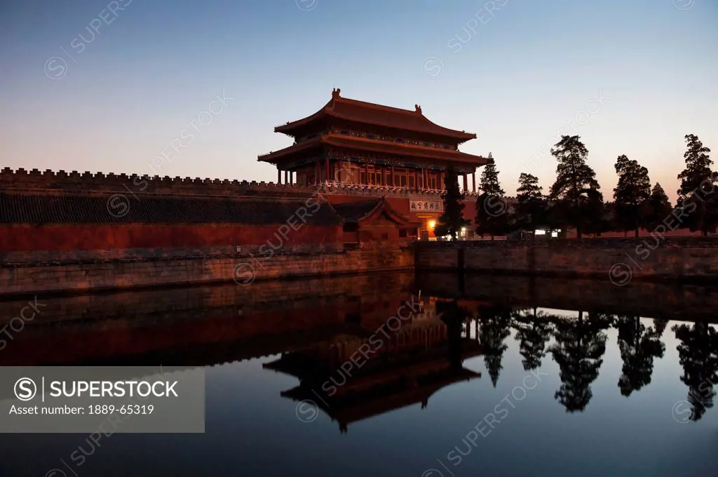 moat at gate of divine might in forbidden city, beijing, china