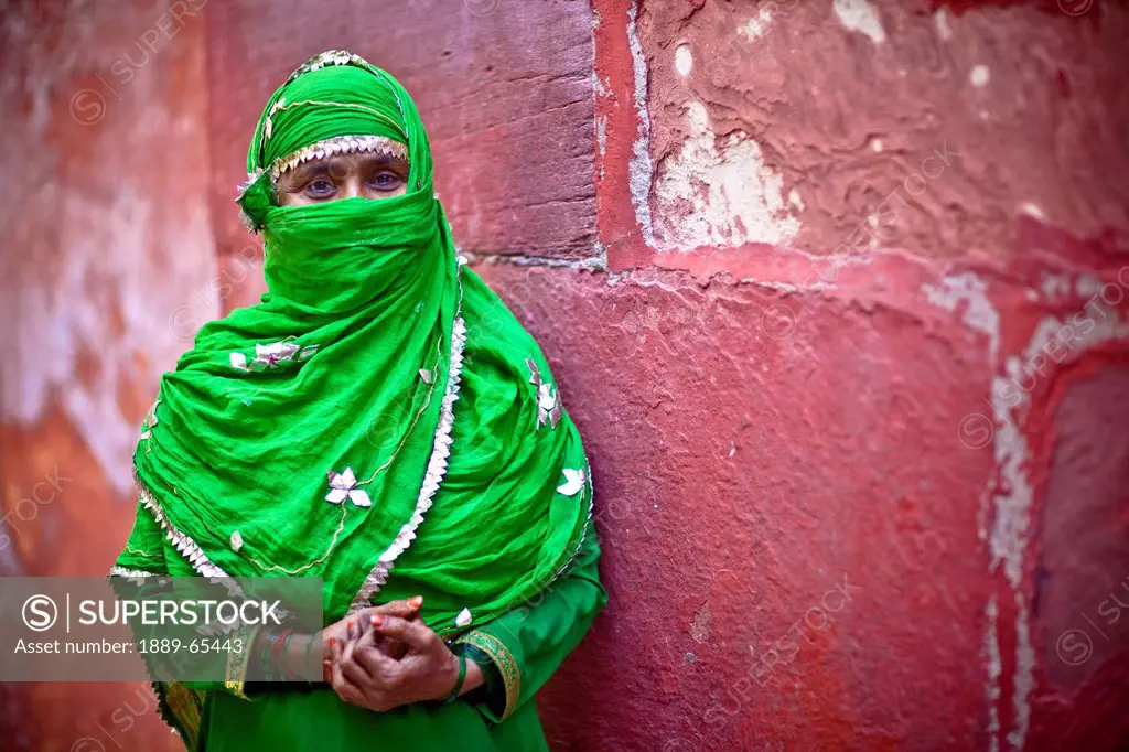 A Muslim Woman In A Green Scarf A Duptta Smiles For The Camera With Just Her Eyes, India