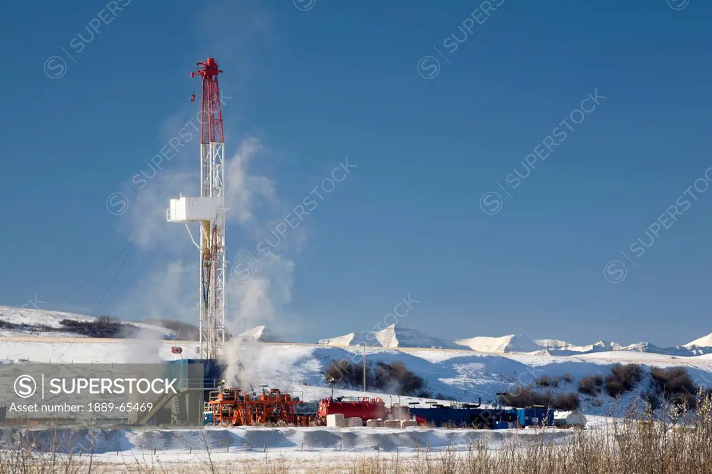 oil drilling rig in winter, longview, alberta, canada