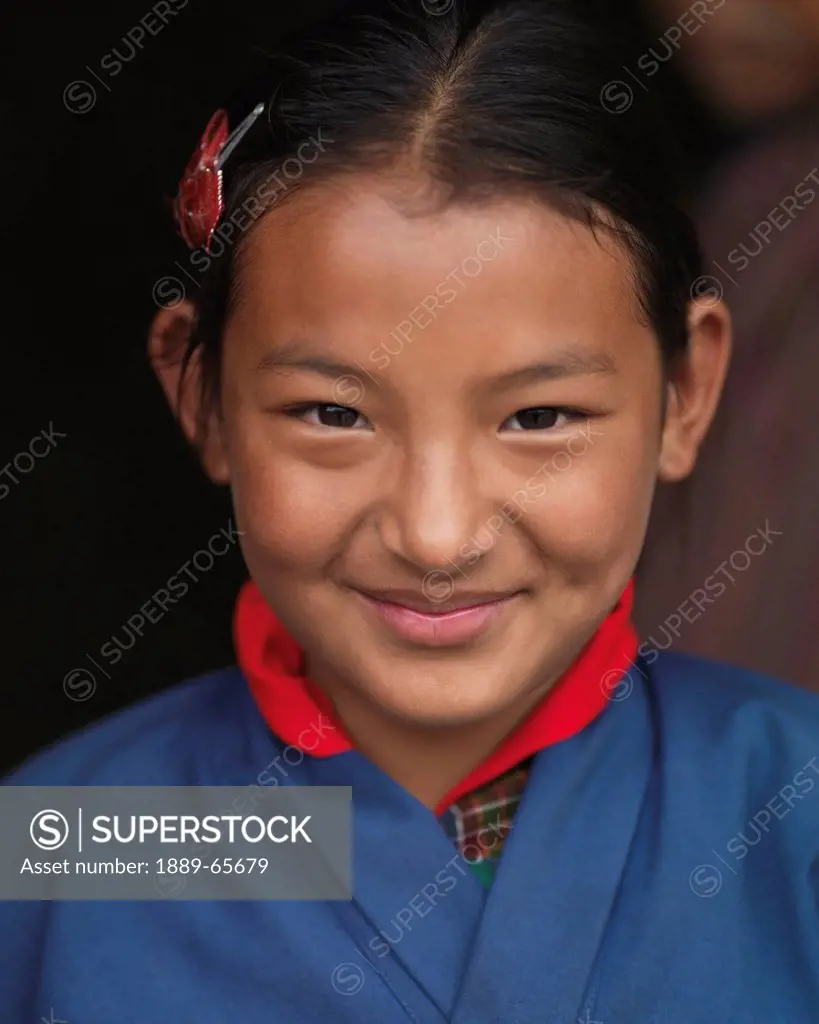 A Young Girl In A Blue Robe At The National Memorial Chorten, Thimphu Thimphu District Bhutan